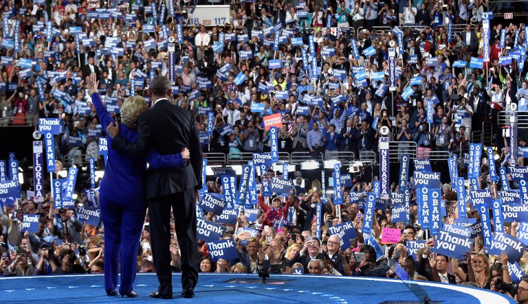 Former President Barack Obama and then-Democratic presidential candidate Hillary Clinton wave to the crowd following Obama's speech at the Democratic National Convention in Philadelphia on July 27, 2016.