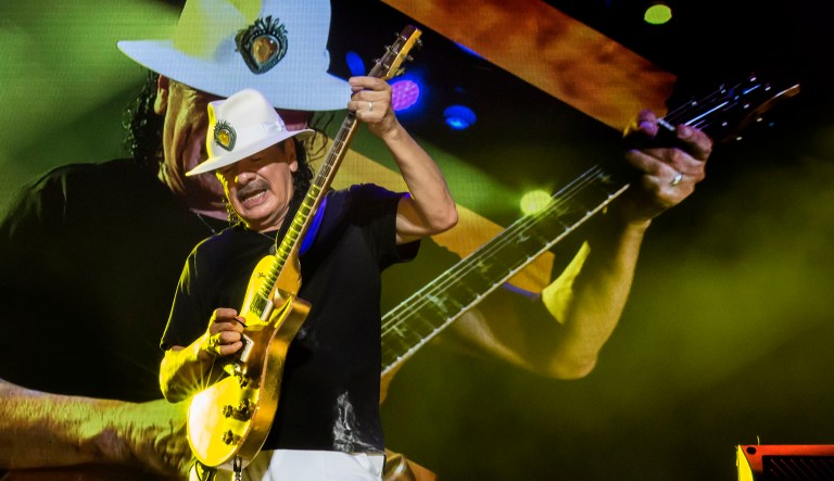 Mexican-born US guitarist Carlos Santana performs during a concert.