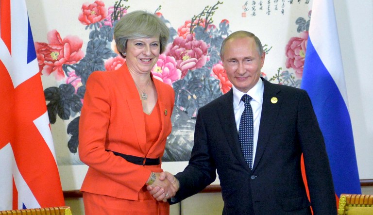 Russian President Vladimir Putin, right, shakes hands with British Prime Minister Theresa May during a bilateral meeting in Hangzhou, China, Sunday, Sept. 4, 2016, ahead of the G-20 Leaders Summit.