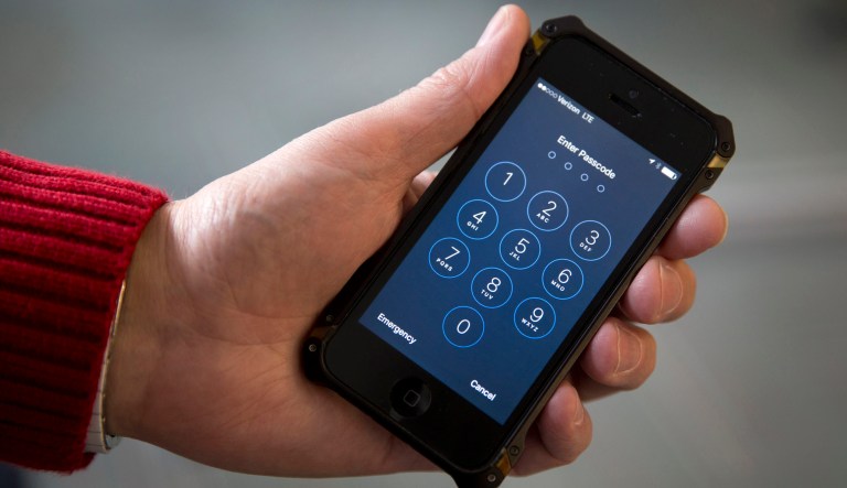 FILE - In this Feb. 17, 2016 file photo an iPhone is seen in Washington. The Associated Press and two other news organizations sued the FBI on Friday to learn who the government paid and how much it spent to hack into an iPhone in its investigation into last year's San Bernardino, California, massacre.