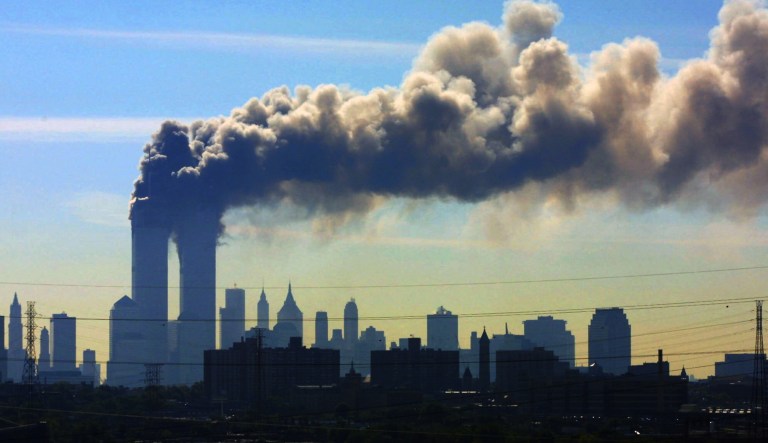Smoke billows from the twin towers of the World Trade Center in New York after airplanes crashed into both towers. 