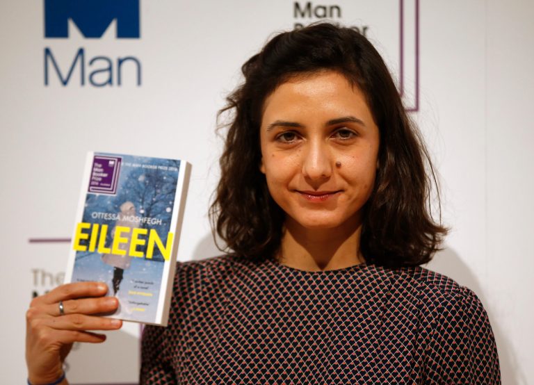 Writer Ottessa Moshfegh poses with her book "Eileen."