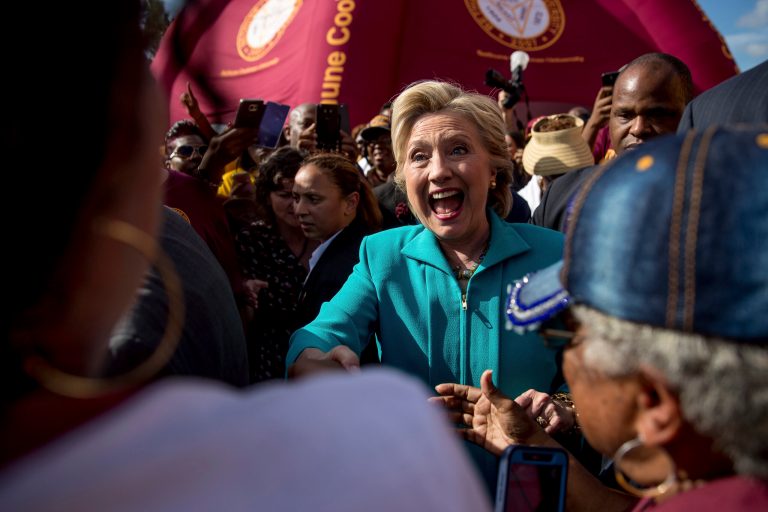 Democratic presidential candidate Hillary Clinton greets people at a homecoming tailgate party for Bethune-Cookman University Wildcats as they take on the Delaware State Hornets in Daytona Beach, Fla., Saturday, Oct. 29, 2016, to attend a rally.