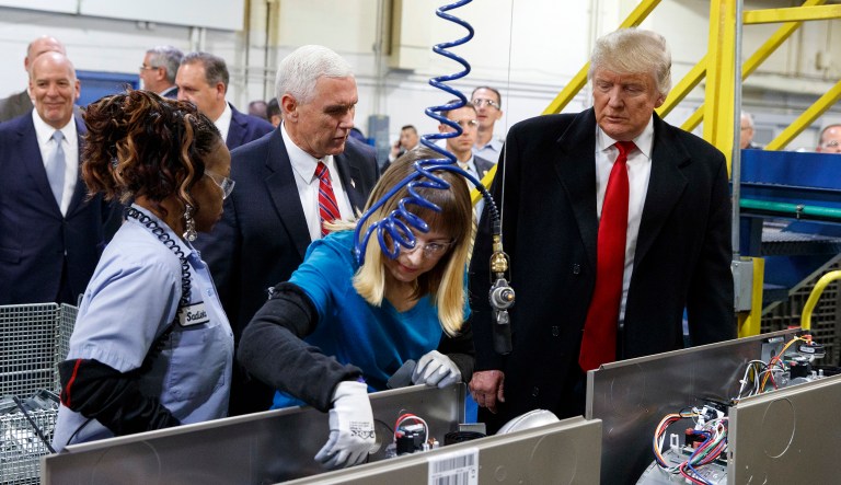 President-elect Donald Trump and Vice President-elect Mike Pence watch as employees work during a visit to Carrier factory, Thursday, Dec. 1, 2016, in Indianapolis, Ind.