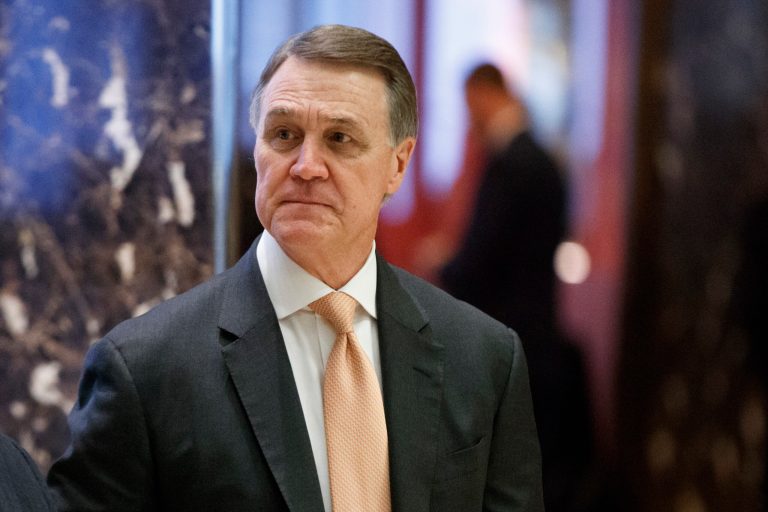 Sen. David Perdue, R-Ga., walks to the elevator for a meeting with President-elect Donald Trump at Trump Tower, Friday, Dec. 2, 2016, in New York.