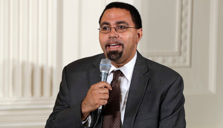 Former Education Secretary John King Jr. speaks on a panel to college-bound students. 