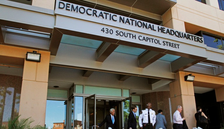 People stand outside the Democratic National Committee headquarters in Washington.