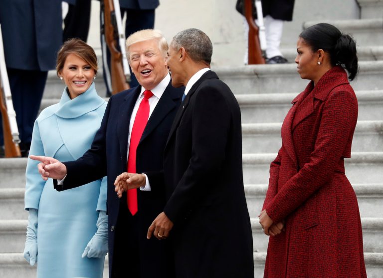 First lady Melania Trump stands as President Trump and former President Barack Obama talk during the 2017 Inauguration, with former first lady Michelle Obama, as they pause on the steps of the East Front of the U.S. Capitol as the Obamas depart, Friday, Jan. 20, 2017 in Washington.