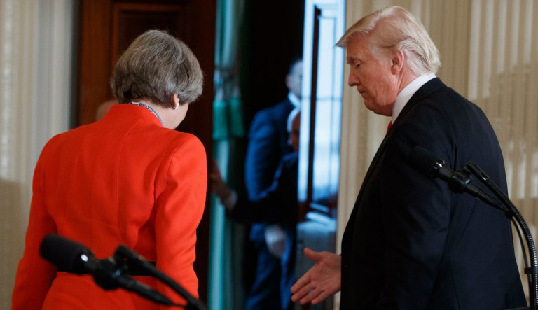 President Trump speaks with British Prime Minister Theresa May after a joint news conference in the East Room of the White House in Washington.