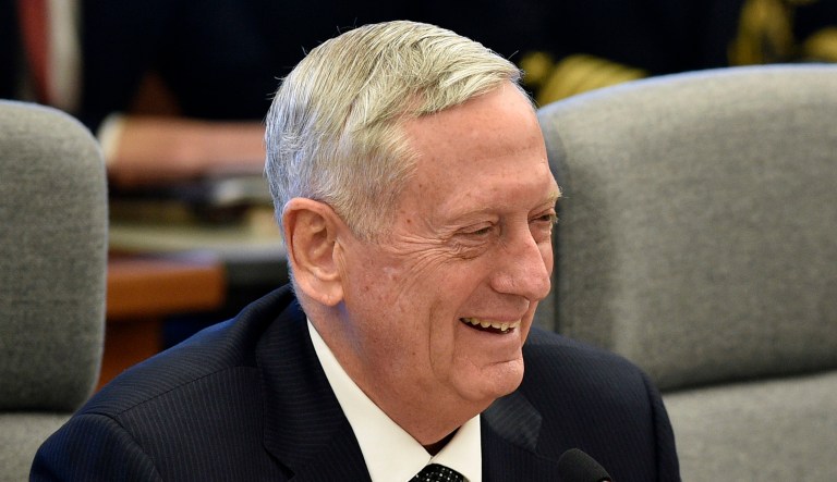 Defense Secretary Jim Mattis smiles while speaking at an event.
