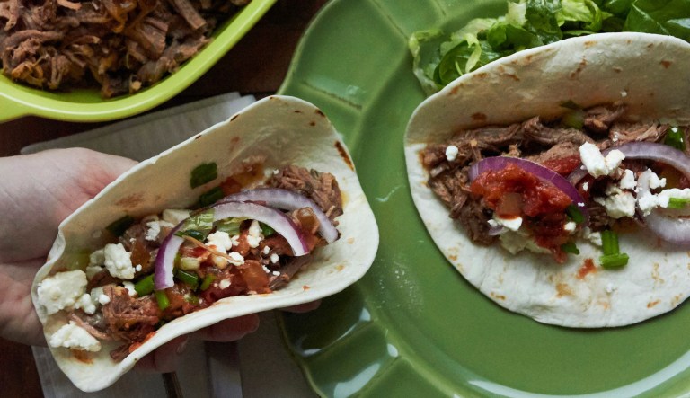 This December 2016 photo shows barbacoa beef tacos in New York. This dish is from a recipe by Katie Workman.