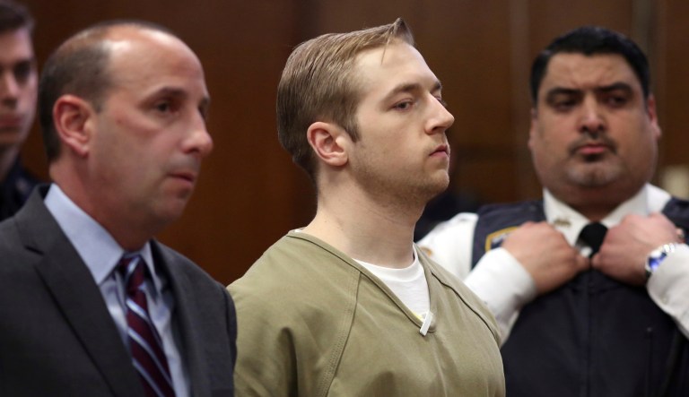 James Harris Jackson, center, a white racist accused of fatally stabbing a 66-year-old stranger on a Manhattan street because he was black, appears in Manhattan Criminal Court, with his attorney Sanford Talkin, left, in New York.