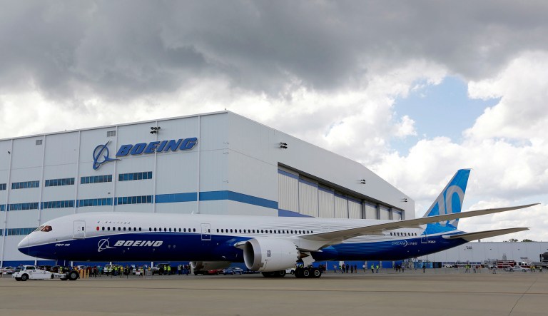 Boeing employees stand near a plane in South Carolina.