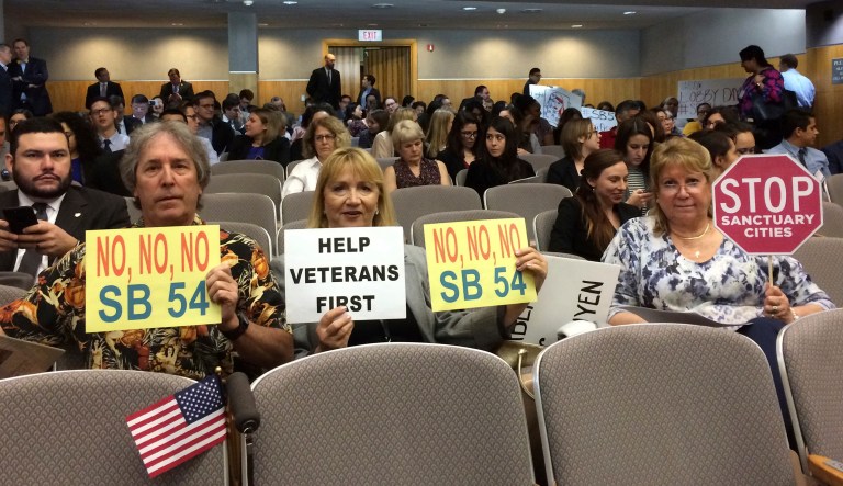 Opponents of SB54, which would create a statewide sanctuary for immigrants in the country illegally, prepare to testify against the measure in the Senate Appropriations Committee in Sacramento, Calif. California lawmakers gave initial approval Monday, April 3, to a measure that prevents law enforcement from cooperating with federal immigration officials, a measure that proponents said rebukes President Donald Trump for his immigration crackdown. (AP Photo/Don Thompson, File)