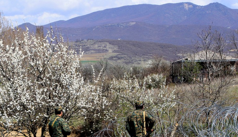 Georgian border guards patrol a border with Georgia's breakaway region of South Ossetia, near the village of Khurvaleti, Georgia.