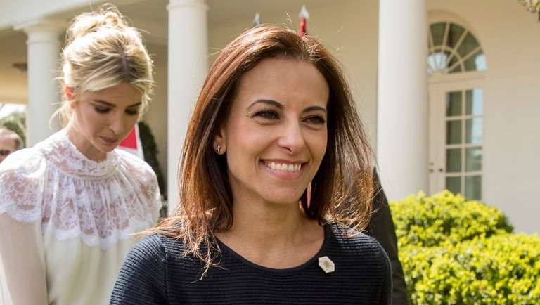 Dina Powell leaves a news conference in the Rose Garden at the White House.