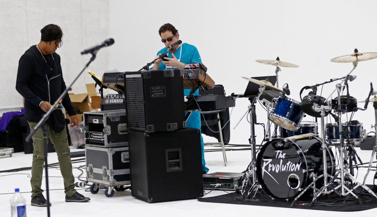 Keyboarder Matt Fink (right) and bassist BrownMark prepare for rehearsal at a studio in Minneapolis.