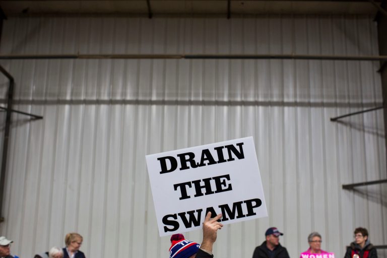 In this Oct. 27, 2016 file photo, supporters of then-Republican presidential candidate Donald Trump hold signs during a campaign rally in Springfield, Ohio.