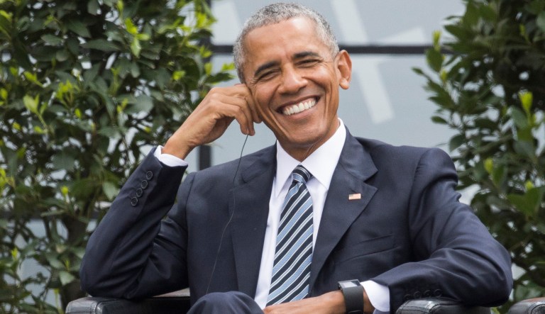 Former President Barack Obama smiles during an event in Germany.