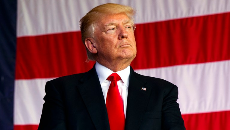 President Donald Trump is introduced to speak to U.S. military troops.