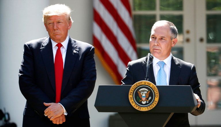 President Trump listens as then-EPA Administrator Scott Pruitt speaks about the U.S. role in the Paris climate change accord, Thursday, June 1, 2017, in the Rose Garden of the White House in Washington.