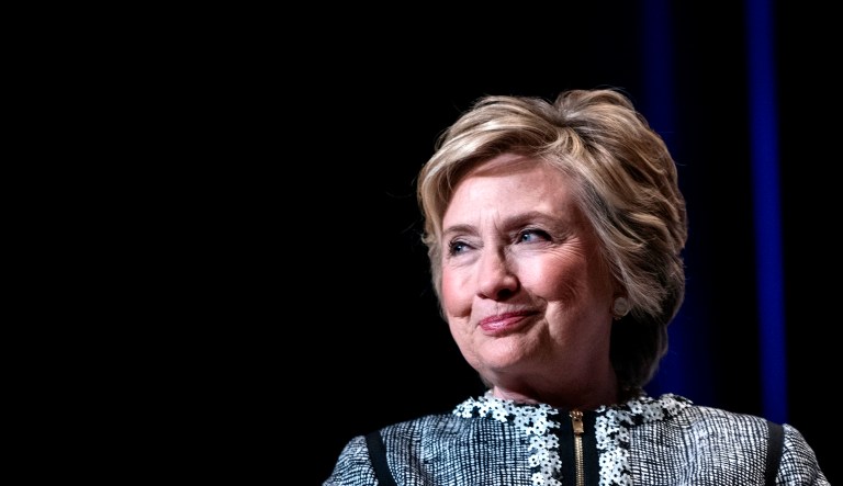 Former Secretary of State Hillary Clinton pauses while speaking during an event.
