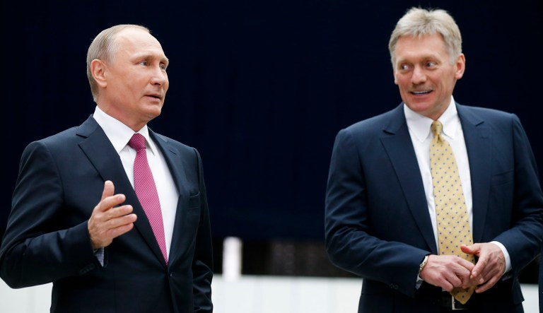 Russian President Vladimir Putin speaks to the media after his annual televised call-in show as his press secretary Dmitry Peskov, right, smiles in Moscow, Russia, Thursday, June 15, 2017. The 64-year old Russian leader mixed the tough talk with benevolent promises to disgruntled callers complaining about decrepit housing and low salaries during the four-hour marathon intended to burnish his father-of-the nation image.