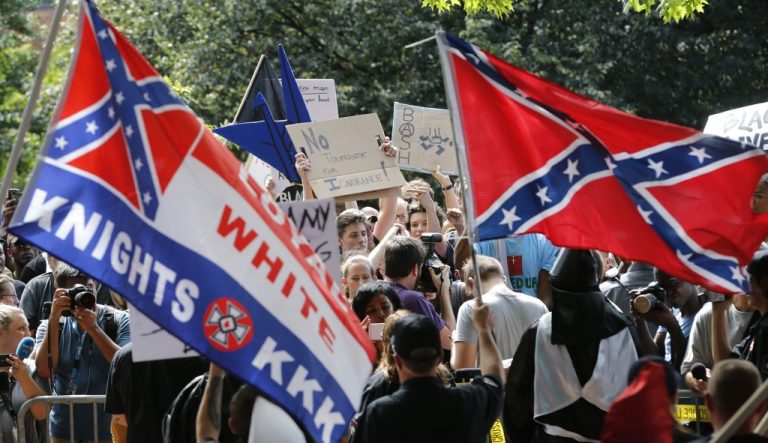 A large group of protesters demonstrate against a KKK rally.