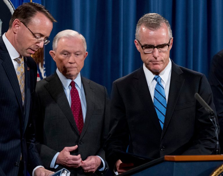 FBI Acting Director Andrew McCabe, right, accompanied by Attorney General Jeff Sessions, second from left, Deputy Attorney General Rod Rosenstein, takes the podium at a news conference to announce an international cybercrime enforcement action at the Department of Justice, Thursday, July 20, 2017, in Washington.