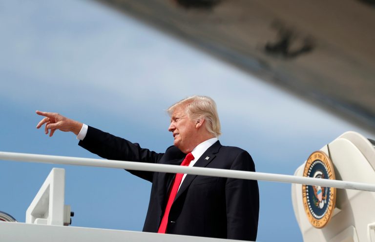 In this photo from 2017, President Trump points as he boards Air Force One in Andrews Air Force Base, Md.