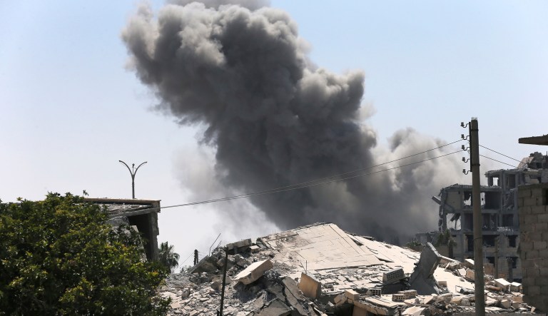 Black smoke rises from a coalition airstrike in Syria. 