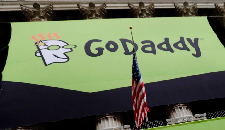 A GoDaddy sign is placed in front of the New York Stock Exchange in New York City.