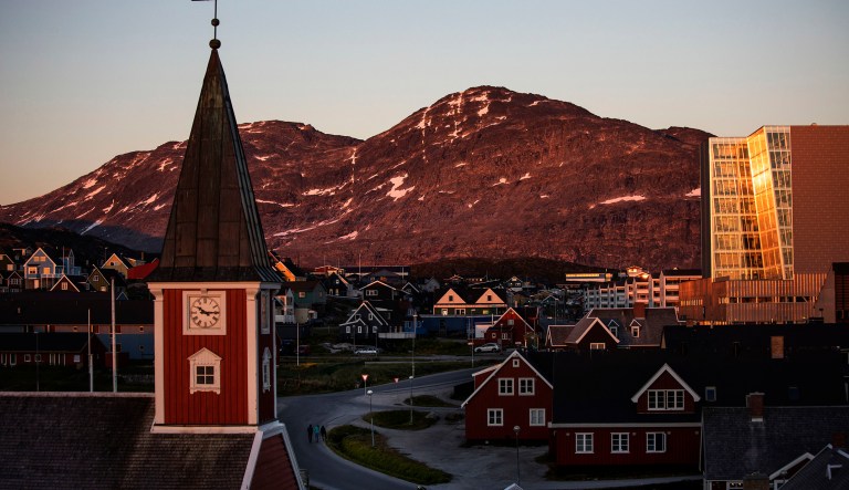 The sun sets over Nuuk, Greenland. 