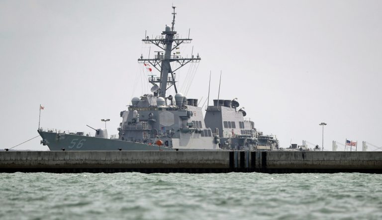 The USS John S. McCain is seen docked at Changi naval base on Monday, Aug. 21, 2017 in Singapore. 