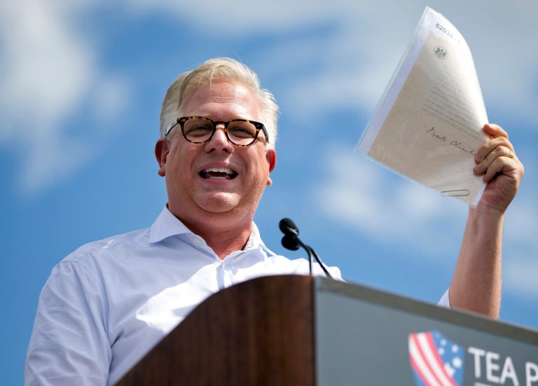 FILE - In this Wednesday Sept. 9, 2015, file photo, radio host Glenn Beck speaks during a Tea Party rally against the Iran deal on the West Lawn of the Capitol in Washington. Beck said on Aug. 31. 2017, he had cut 20 percent of the staff at his companies, The Blaze and Mercury Radio Arts.