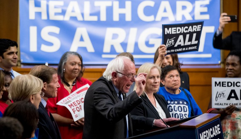 Sen. Bernie Sanders, I-Vt., center, accompanied by Sen. Kirsten Gillibrand, D-N.Y., center right, speaks at a news conference on Capitol Hill in Washington, Wednesday, Sept. 13, 2017, to unveil their Medicare for All legislation to reform health care. 