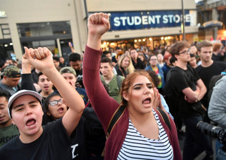 Protesters shout before a speaking engagement by conservative commentator Ben Shapiro on the campus of the University of California Berkeley in Berkeley, Calif., on Sept. 14, 2017.