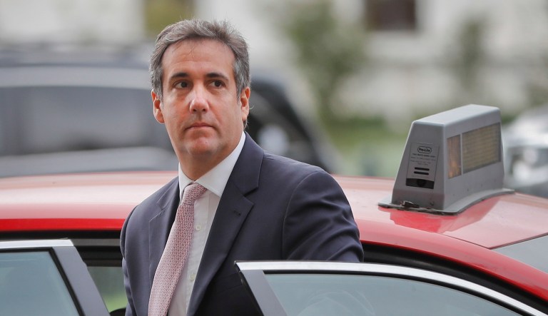 Michael Cohen, President Trump's personal attorney, steps out of a cab during his arrival on Capitol Hill in Washington. 