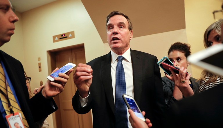 Senate Intelligence Committee Vice Chairman Sen. Mark Warner, D-Va., speaks with reporters on Capitol Hill in Washington. 