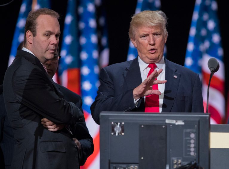 Republican presidential candidate Donald Trump talks during a walk through at the Republican National Convention, Thursday, July 21, 2016, in Cleveland, as Rick Gates, left, watches.