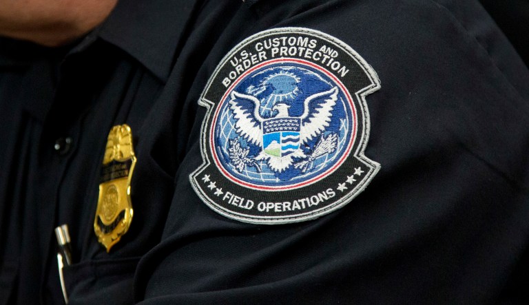 A customs agent wears a patch for the U.S. Customs and Border Protection agency, which is a part of the Department of Homeland Security, on Oct. 27, 2017, at John F. Kennedy International Airport in New York.