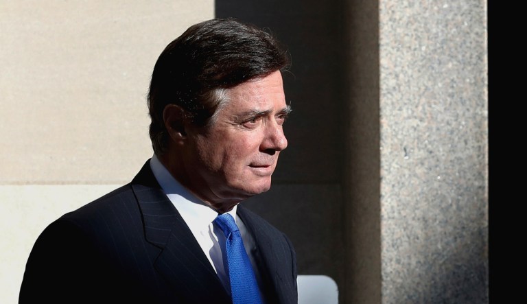 Paul Manafort walks from Federal District Court in Washington.