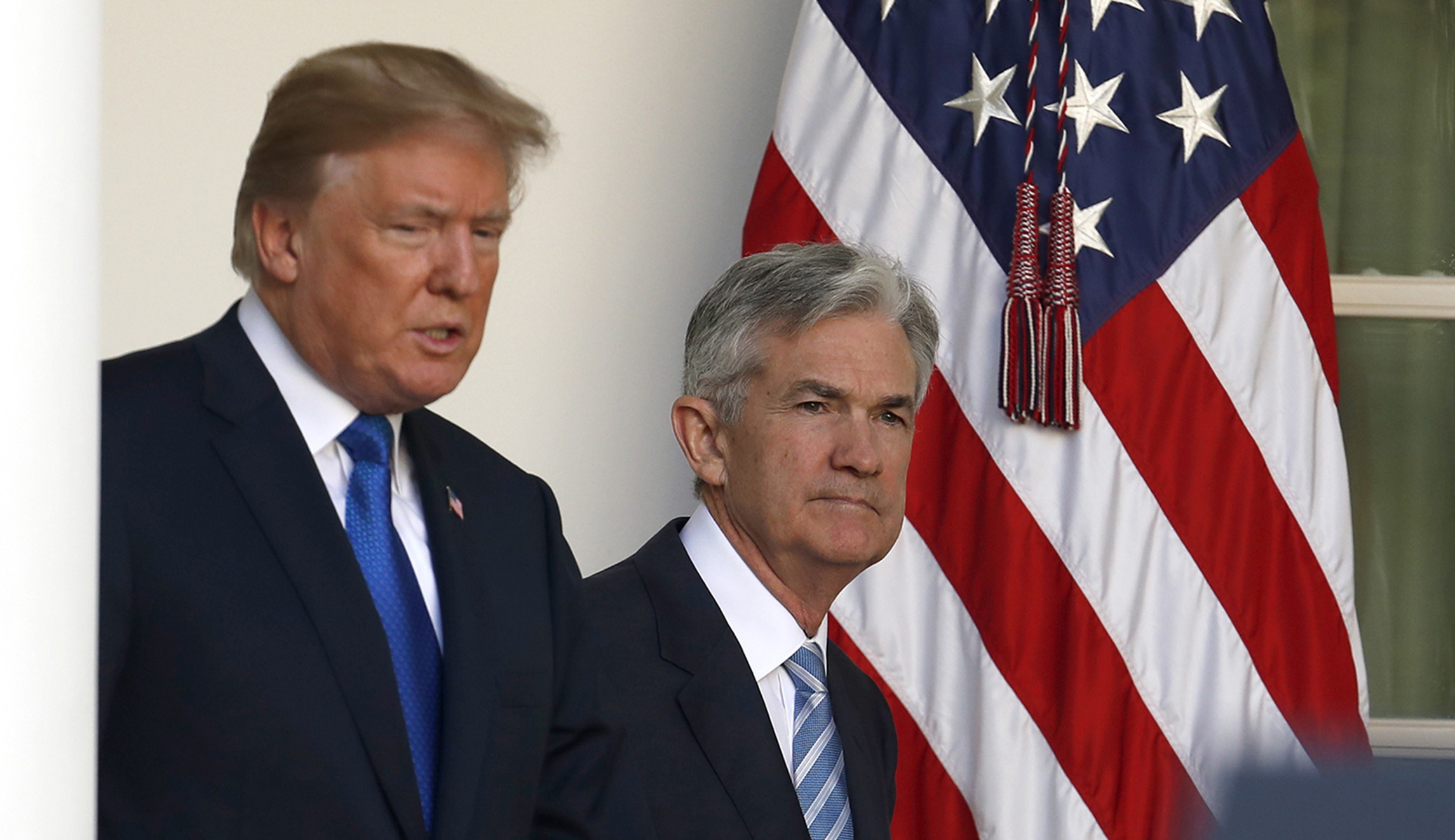 Fed cuts rates, facing global risks and pressure from Trump