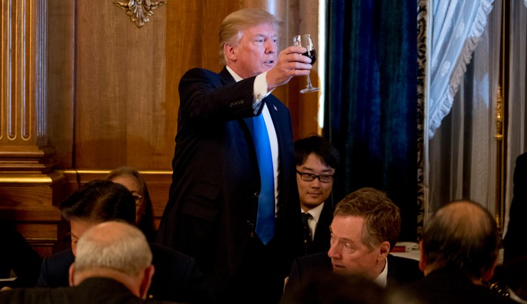 U.S. President Donald Trump holds up his glass for a toast during a state banquet at the Akasaka Palace, Monday, Nov. 6, 2017, in Tokyo. Trump is on a five-country trip through Asia traveling to Japan, South Korea, China, Vietnam and the Philippines.