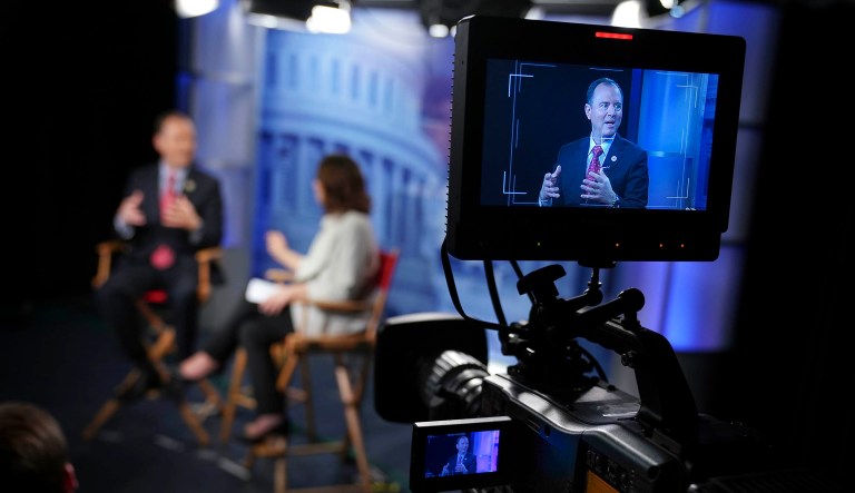 Rep. Adam Schiff, D-California, is seen on television camera monitors as he answers questions during an interview.