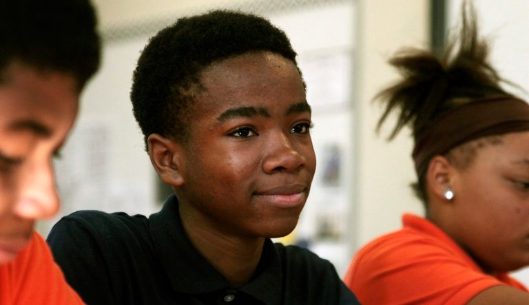 In this Oct. 20, 2017 photo, Jamain Lee, 13, sits in class at Milwaukee Math and Science Academy, a charter school in Milwaukee. 