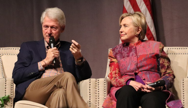 Accompanied by his wife, Hillary Clinton, former President Bill Clinton speaks at a gathering in Little Rock, Ark. 