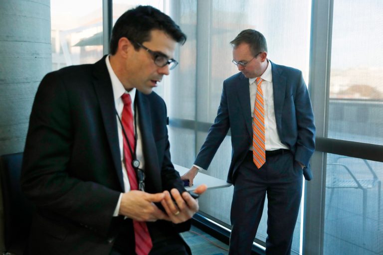 Mick Mulvaney, acting director of the Consumer Financial Protection Bureau in Washington, with John Czwartacki, just named Bureau Communications Director, left.