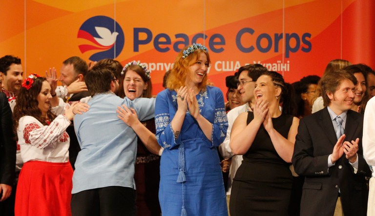Volunteers of US Peace Corps celebrate after they swear an oath of allegiance in Kiev, Ukraine, Thursday, Nov. 30, 2017. The 72 volunteers swore an oath into the US Peace Corps Ukraine Thursday, an organization which was opened in Ukraine in 1992. Since then, 3 177 volunteers, the US citizens, has been worked in US Peace Corps Ukraine.