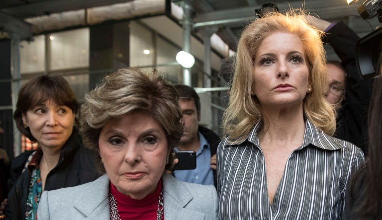 Summer Zervos, center, leaves Manhattan State Supreme court with attorney Gloria Allred, left, after a hearing in New York. Zervos, a contestant on Trump's reality TV show "The Apprentice" in 2006 who accused Trump of unwanted sexual contact in 2007, filed a defamation lawsuit after Trump dismissed her claims as "fabricated and made-up charges." 